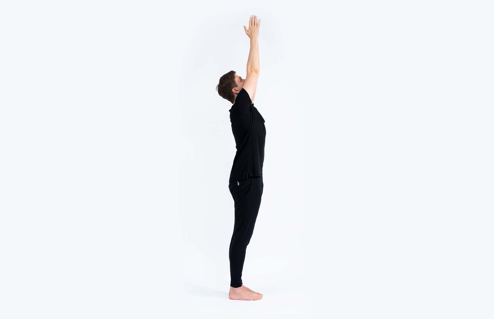 A person reaching arms overhead (Urdhva Hastasana)