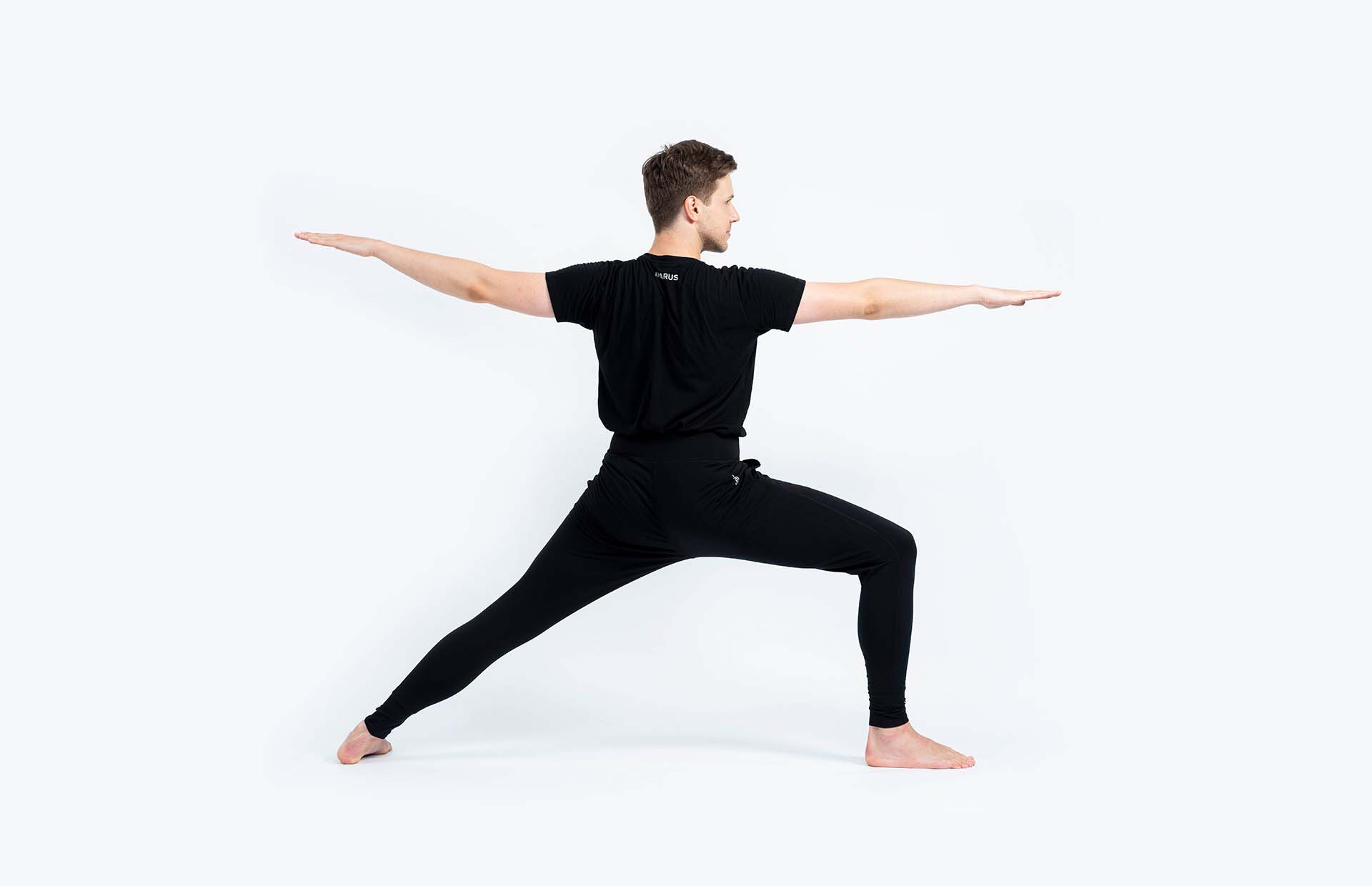 A person looking forward in Virabhadrasana 2 (Warrior 2)