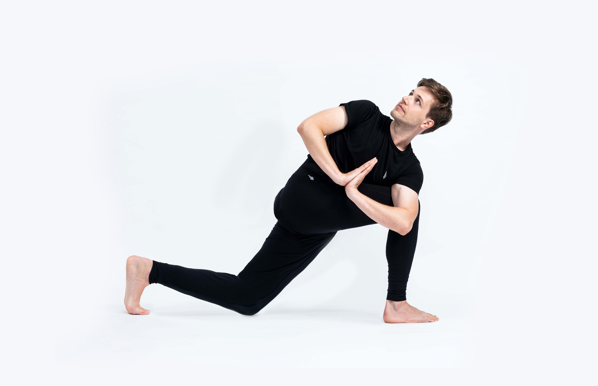 A person in a lunge variation (Parivrtta Parsvakonasana)