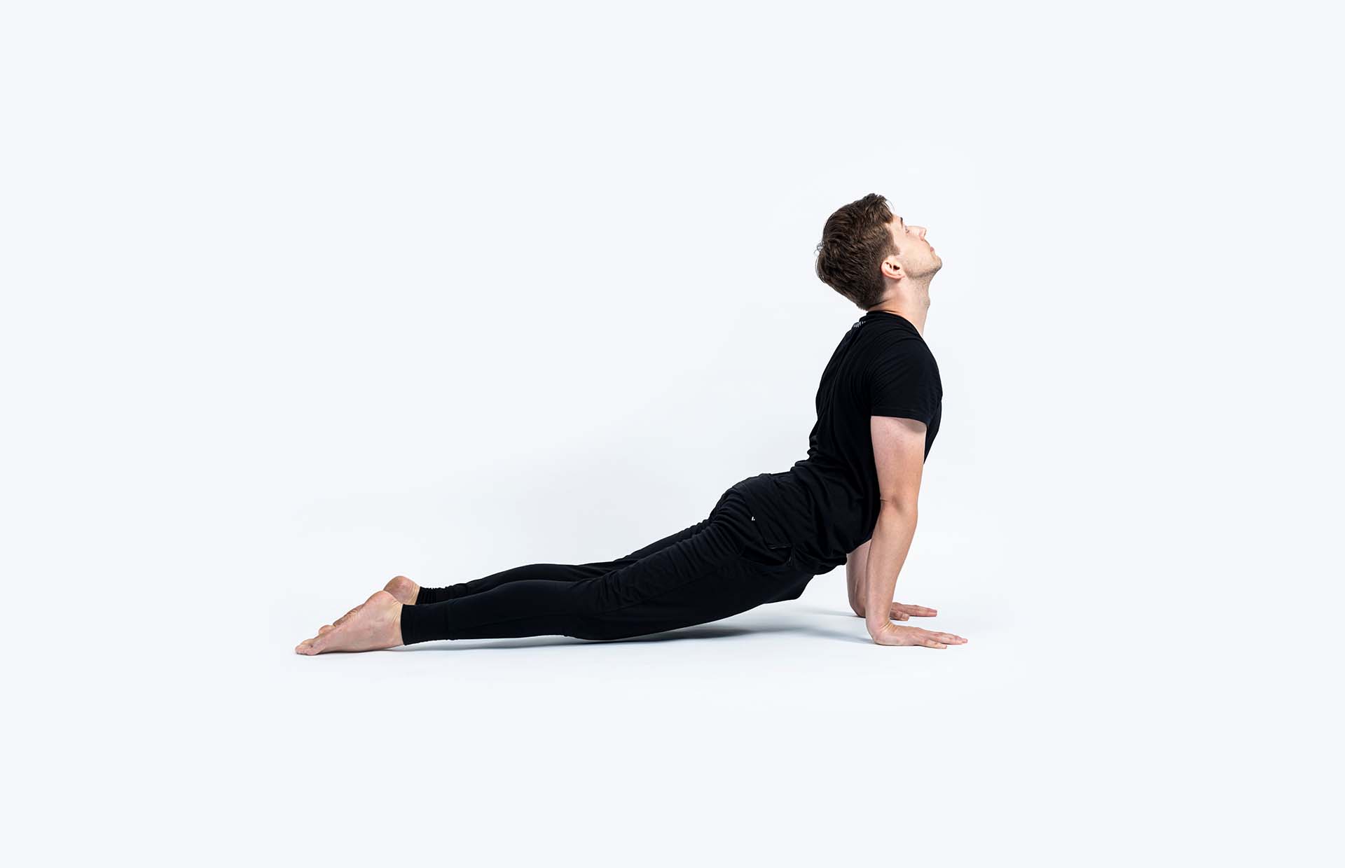 A person extending into Urdhva Mukha Svanasana
