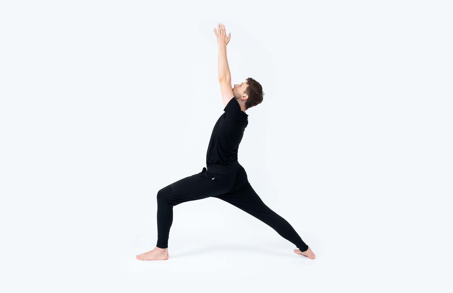 A person in Virabhadrasana 1 (Warrior 1)