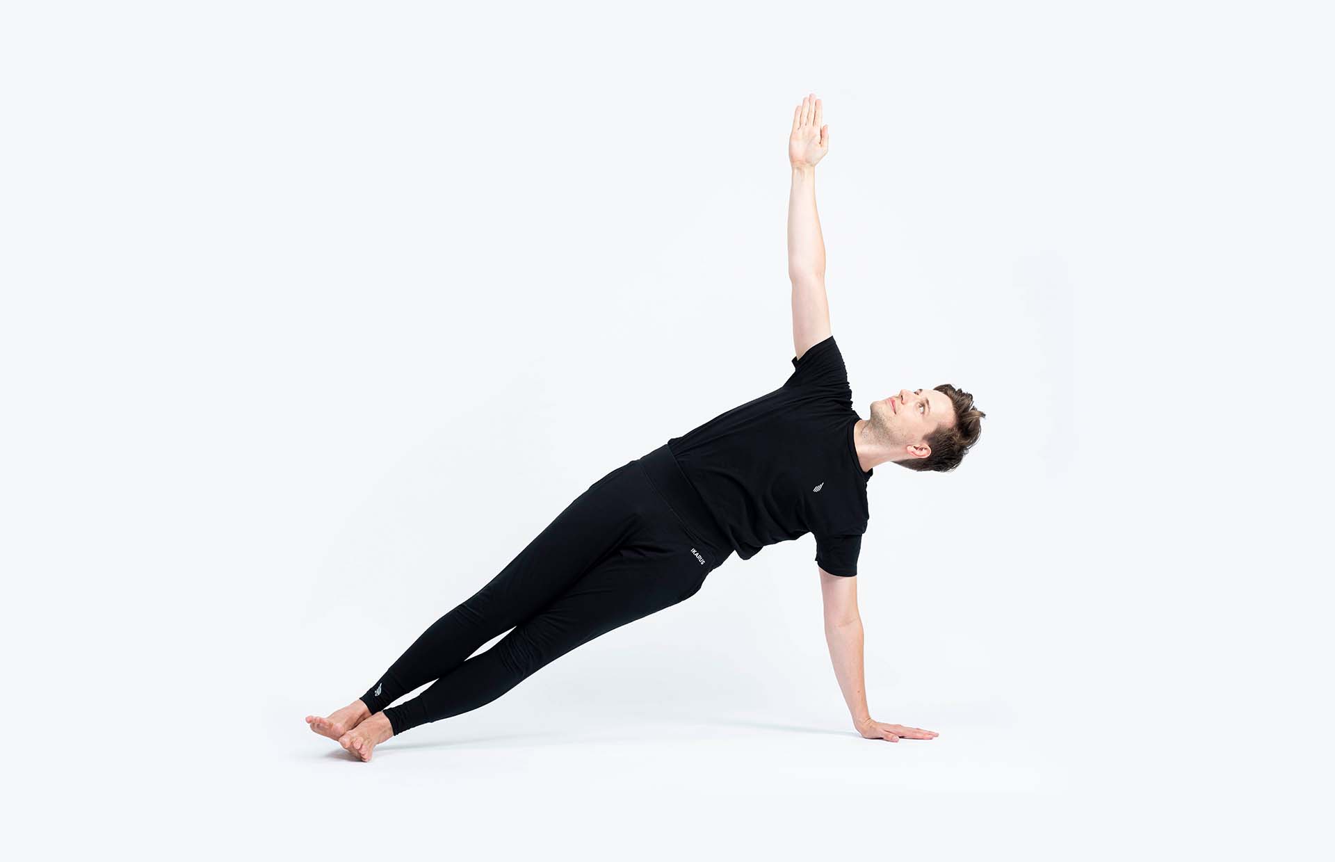 A person balancing in Vasishthasana (Side plank)