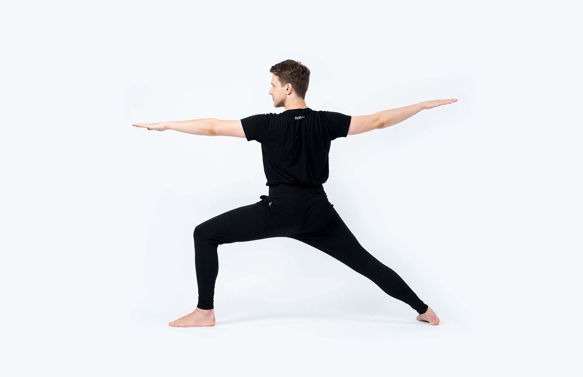 A person in Virabhadrasana 2 (Warrior 2)