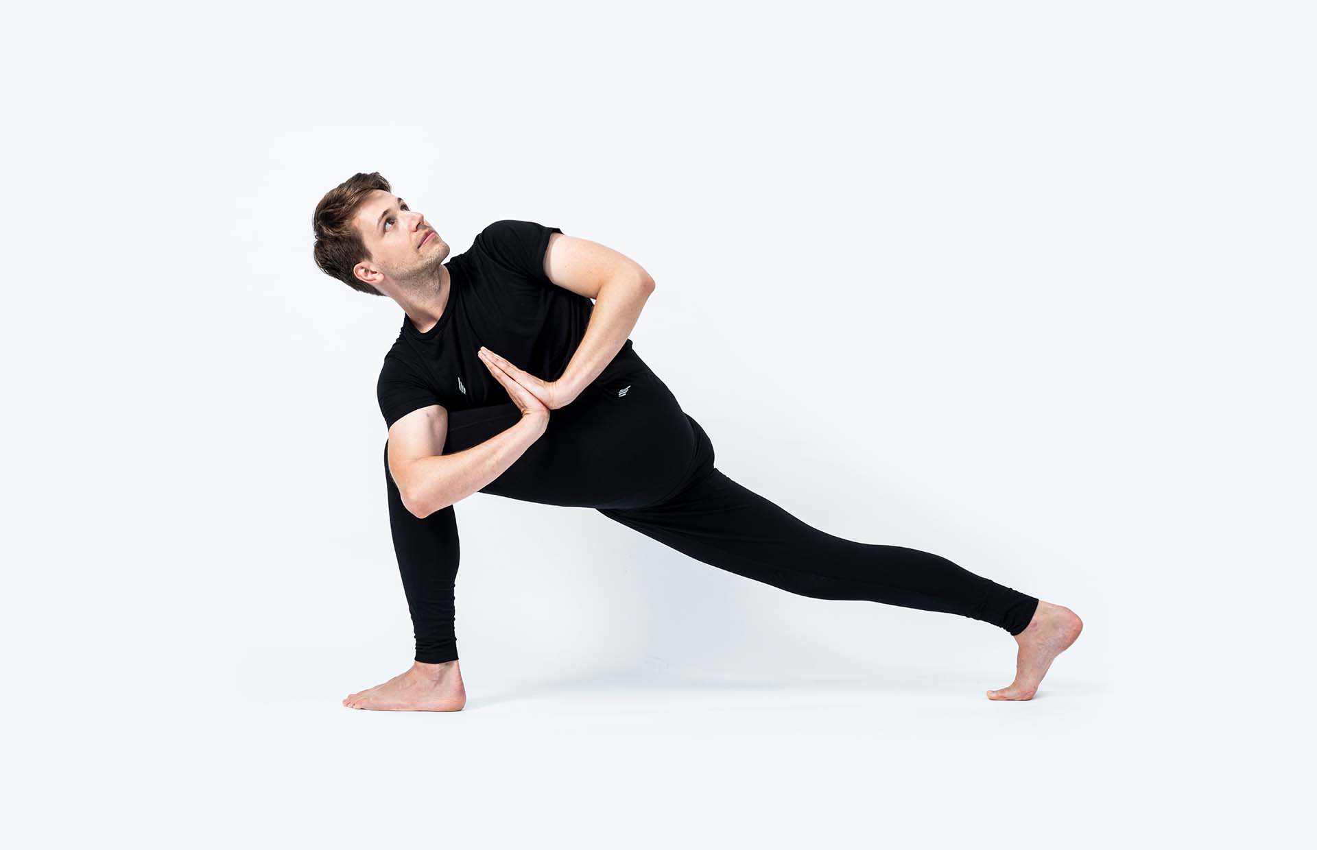 A person in Parivrtta Parsvakonasana