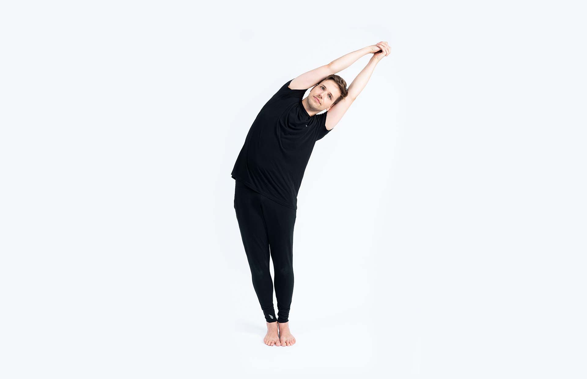 A person bending to the side (Ardha Kati Chakrasana)