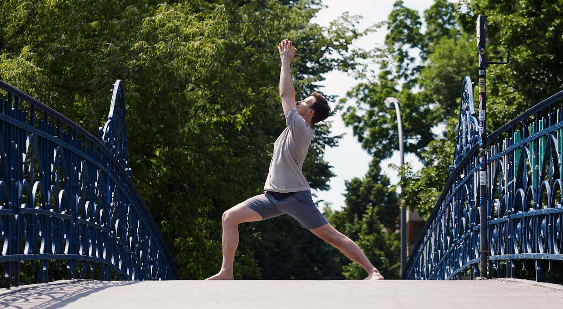 A person looking up into Virabhadrasana 1 (Warrior 1)